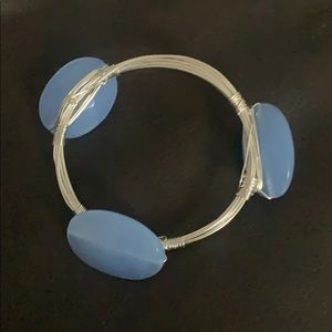 Silver bracelet with blue stones.